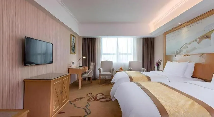 Bed in Vienna Hotel Shenzhen Pingdi Huancheng South Road