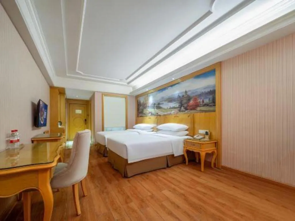 Bed in Vienna Hotel Shenzhen Pingdi Huancheng South Road