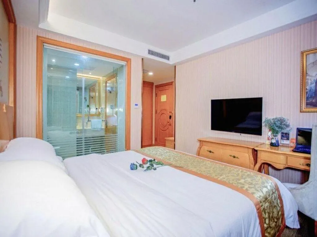 Bed in Vienna Hotel Shandong Laizhou Langhu International Plaza