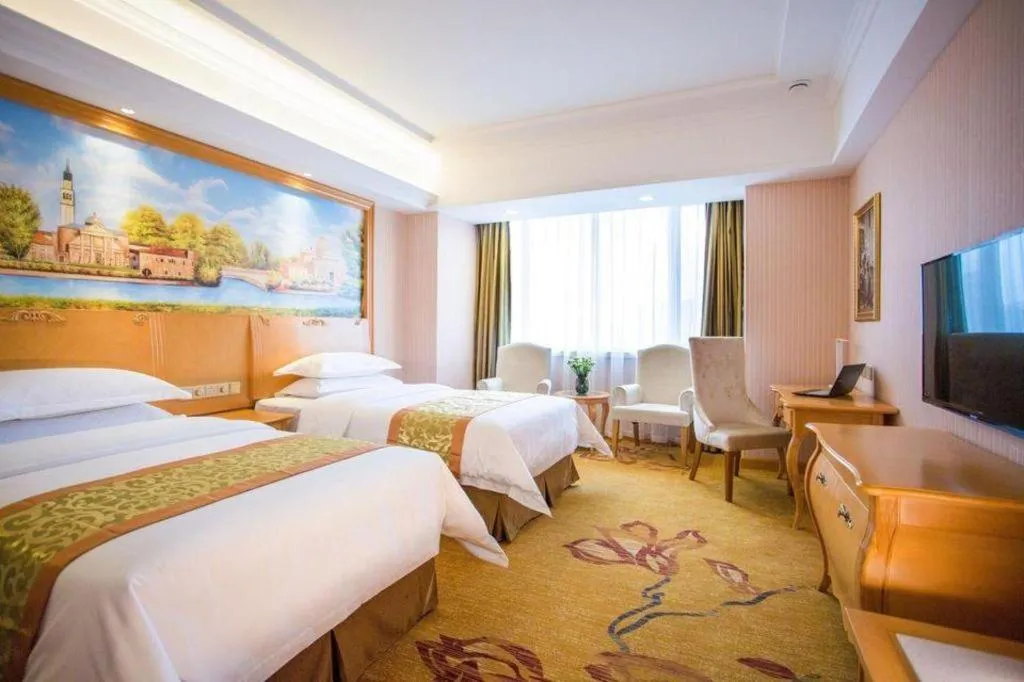 Bed in Vienna Hotel Shandong Laizhou Langhu International Plaza