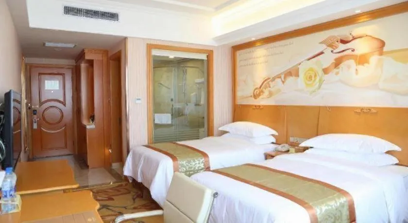 Bed in Vienna Hotel Shandong Laizhou Langhu International Plaza