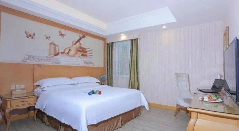 Bed in Vienna Hotel Shandong Laizhou Langhu International Plaza