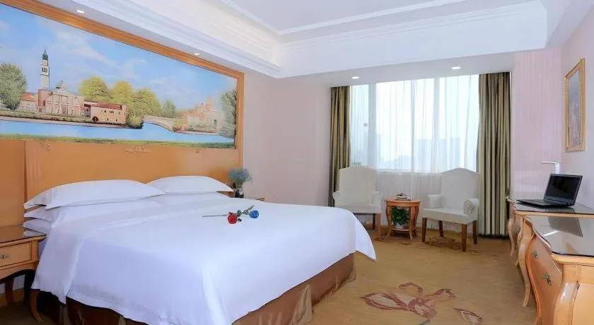 Bed in Vienna Hotel Shandong Laizhou Langhu International Plaza