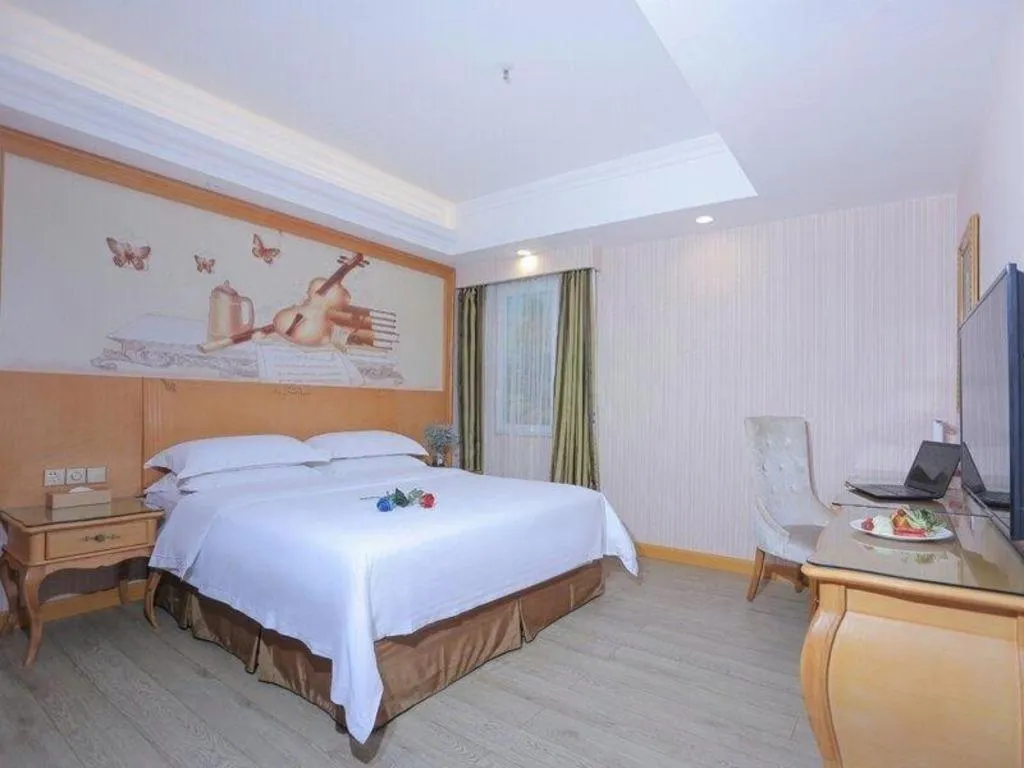 Bed in Vienna Hotel Shandong Laizhou Langhu International Plaza