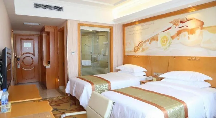 Bed in Vienna Hotel Shandong Laizhou Langhu International Plaza