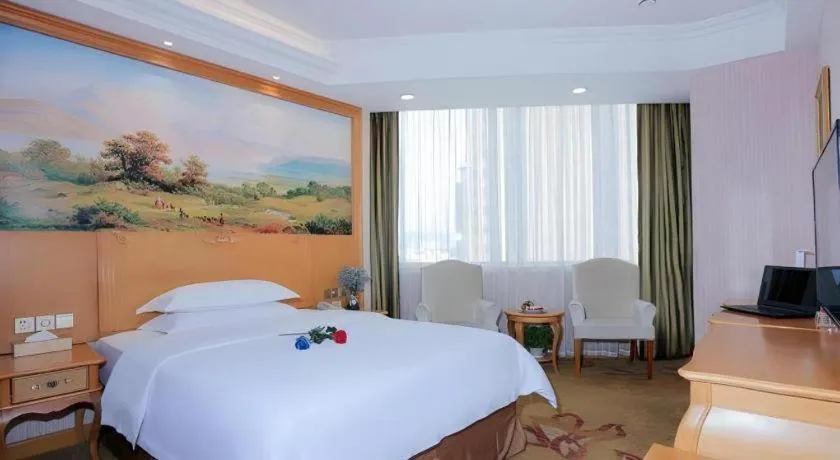 Bed in Vienna Hotel Shandong Laizhou Langhu International Plaza