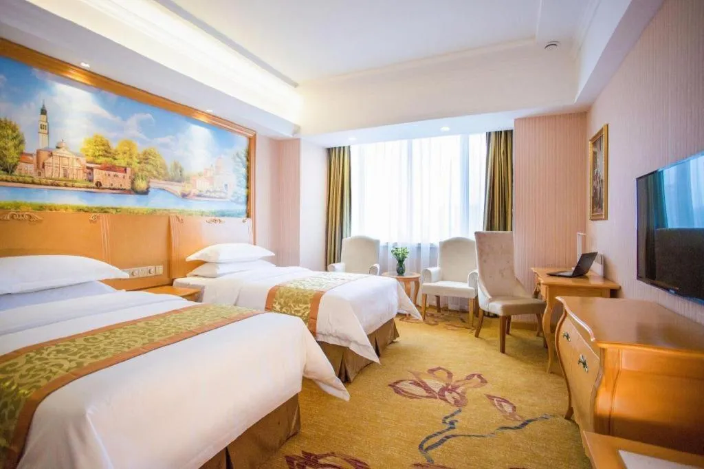 Bed in Vienna Hotel Shandong Laizhou Langhu International Plaza
