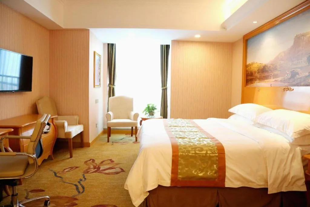 Bed in Vienna Hotel Shandong Laizhou Langhu International Plaza