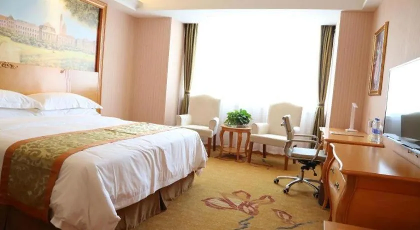 Bed in Vienna Hotel Shandong Laizhou Langhu International Plaza