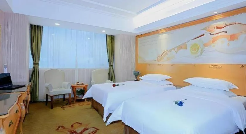 Bed in Vienna Hotel Shandong Laizhou Langhu International Plaza