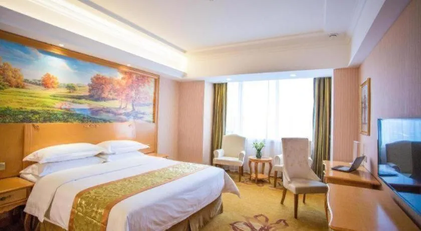 Bed in Vienna Hotel Shandong Laizhou Langhu International Plaza