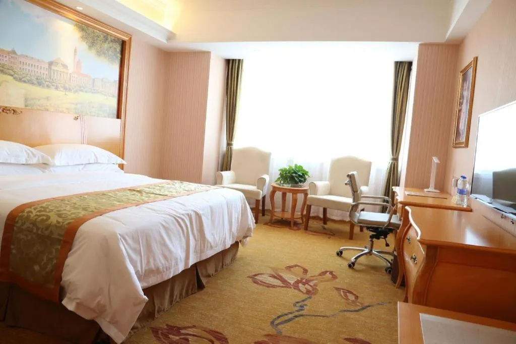 Bed in Vienna Hotel Shandong Laizhou Langhu International Plaza