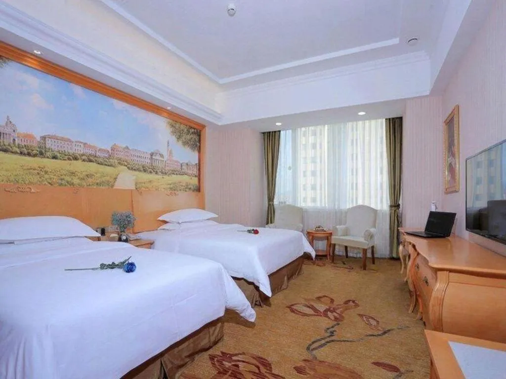 Bed in Vienna Hotel Shandong Laizhou Langhu International Plaza