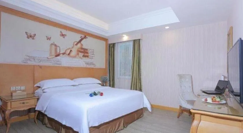 Bed in Vienna Hotel Shandong Laizhou Langhu International Plaza