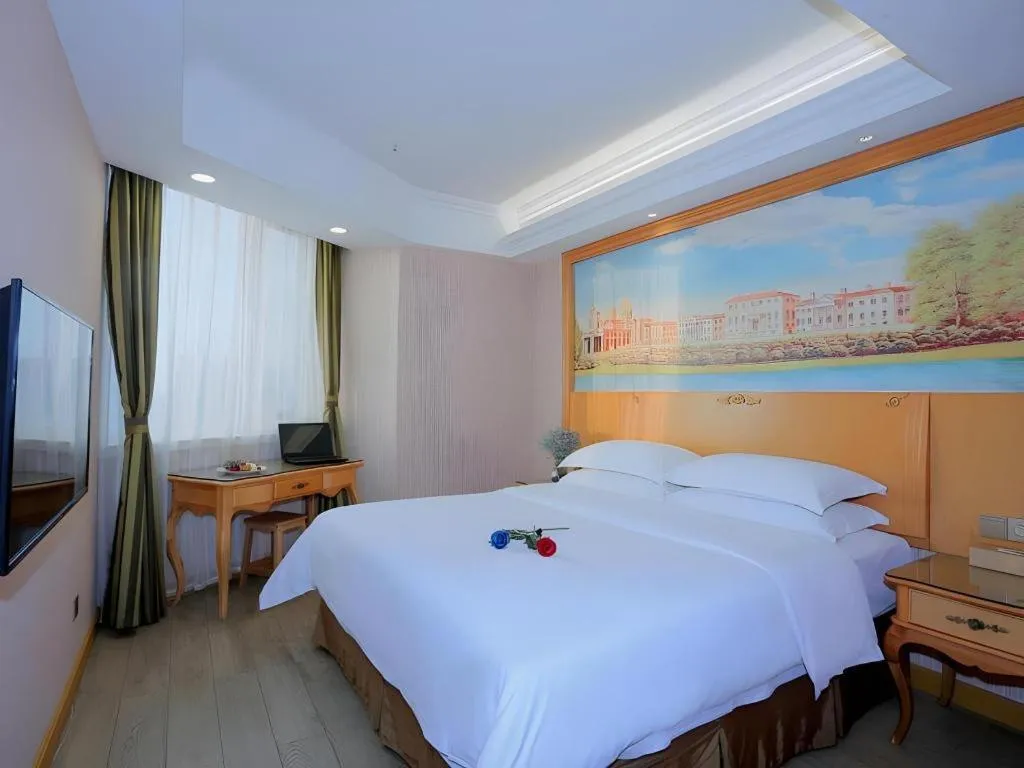 Bed in Vienna Hotel Shandong Laizhou Langhu International Plaza