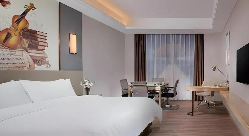 Bed in Vienna Hotel Guangdong Shaoguan Shaonan Avenue