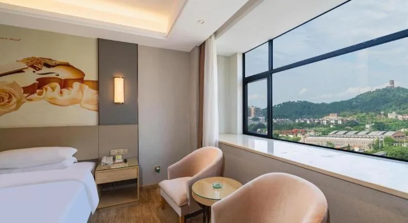 Bed in Vienna Hotel Guangdong Shaoguan Shaonan Avenue