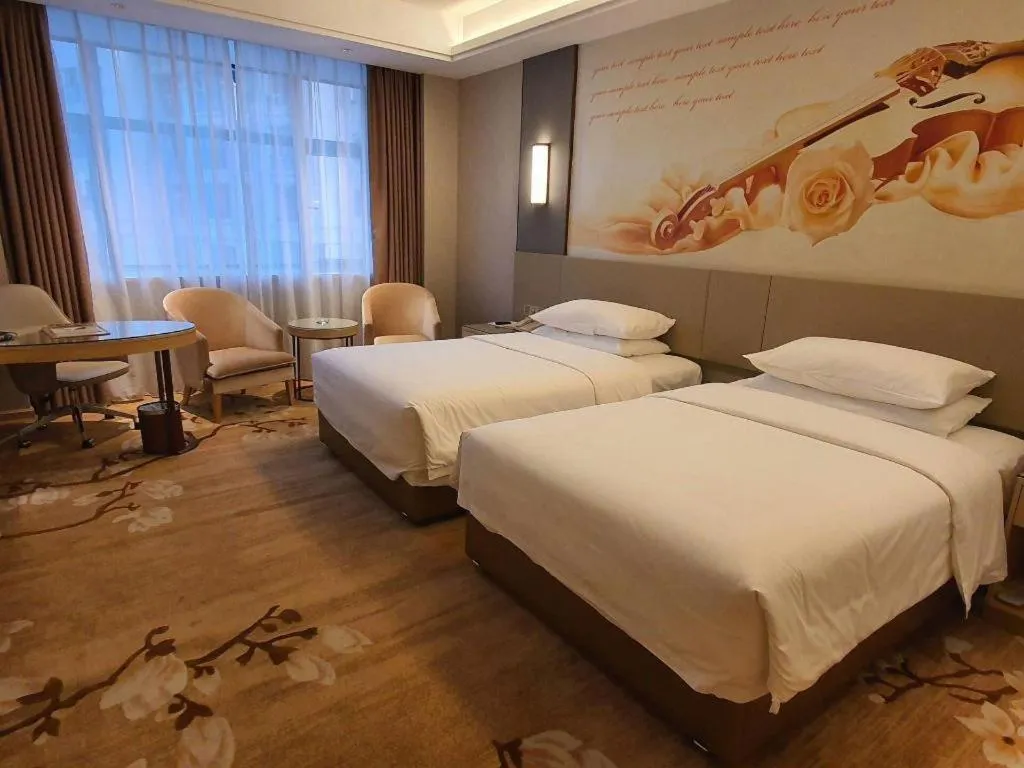 Bed in Vienna Hotel Guangdong Shaoguan Shaonan Avenue
