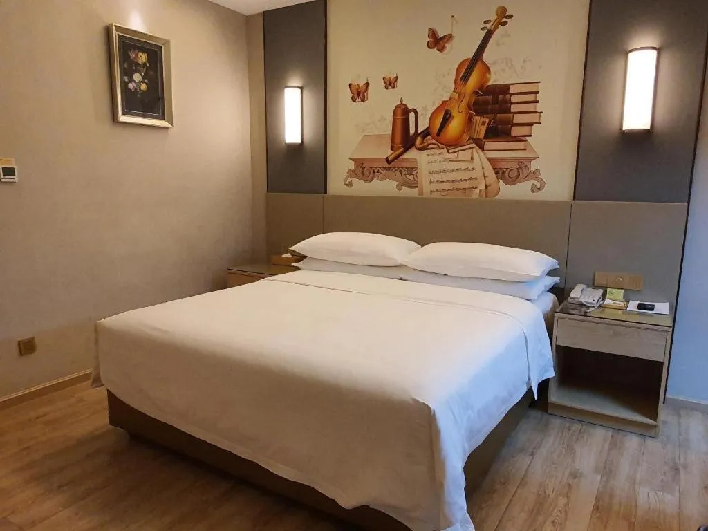 Bed in Vienna Hotel Guangdong Shaoguan Shaonan Avenue