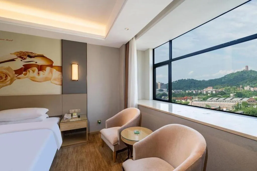 Bed in Vienna Hotel Guangdong Shaoguan Shaonan Avenue