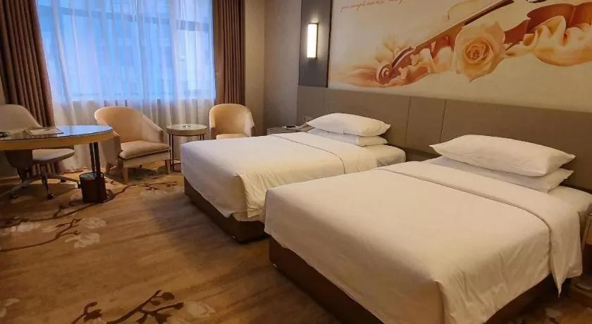 Bed in Vienna Hotel Guangdong Shaoguan Shaonan Avenue