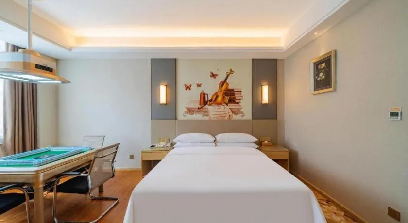 Bed in Vienna Hotel Guangdong Shaoguan Shaonan Avenue