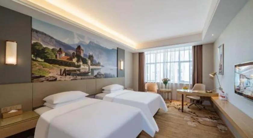 Bed in Vienna Hotel Guangdong Shaoguan Shaonan Avenue