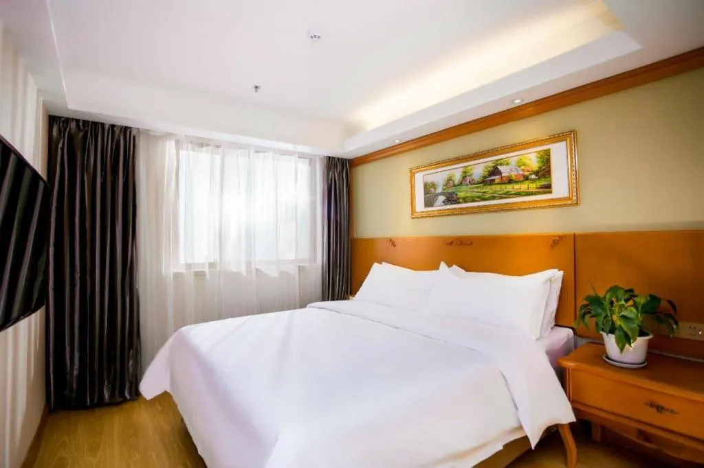 Bed in Vienna Hotel Inner Mongolia Tongliao Development Zone