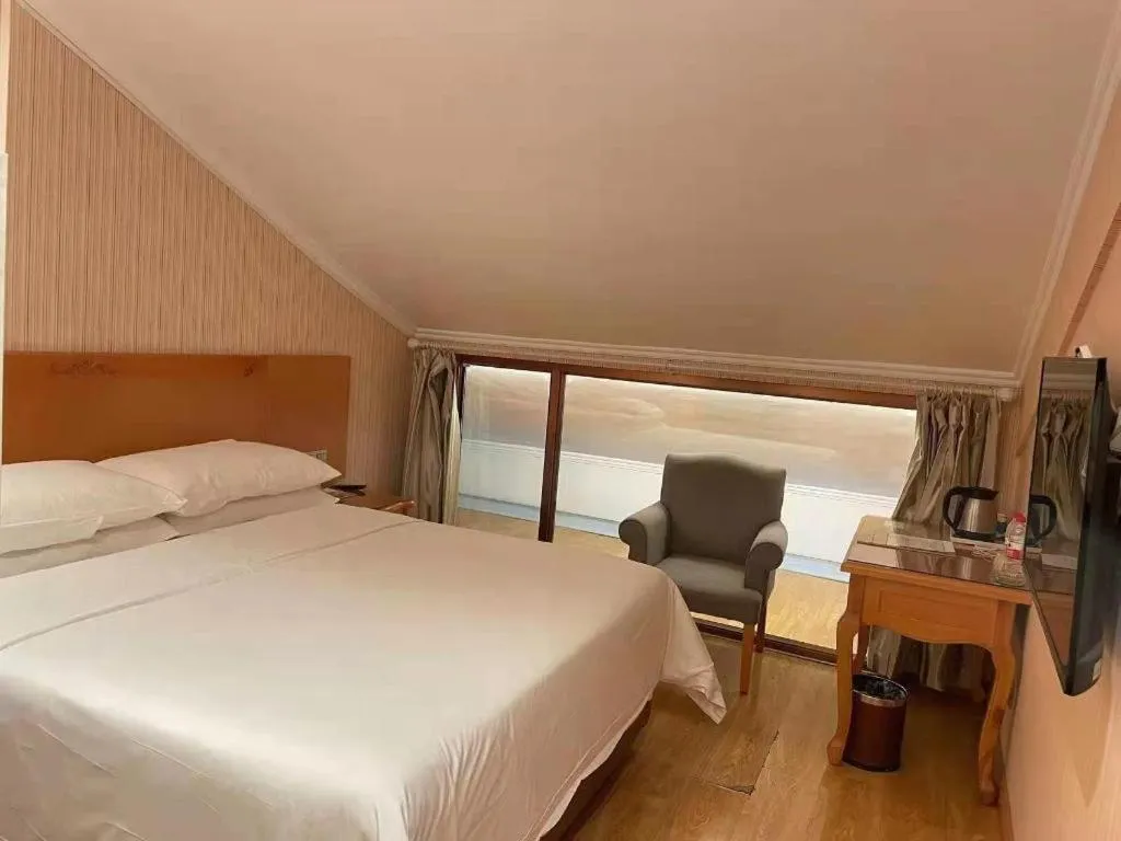 Bed in Vienna Hotel Inner Mongolia Tongliao Development Zone