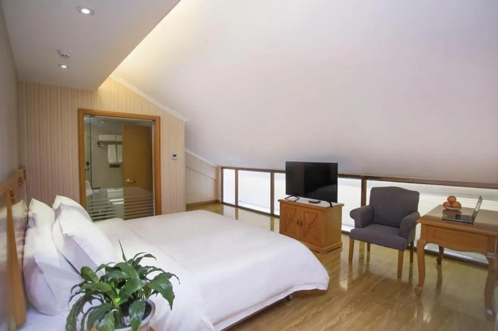 Bed in Vienna Hotel Inner Mongolia Tongliao Development Zone