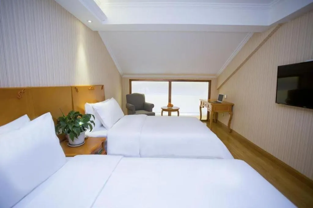 Bed in Vienna Hotel Inner Mongolia Tongliao Development Zone