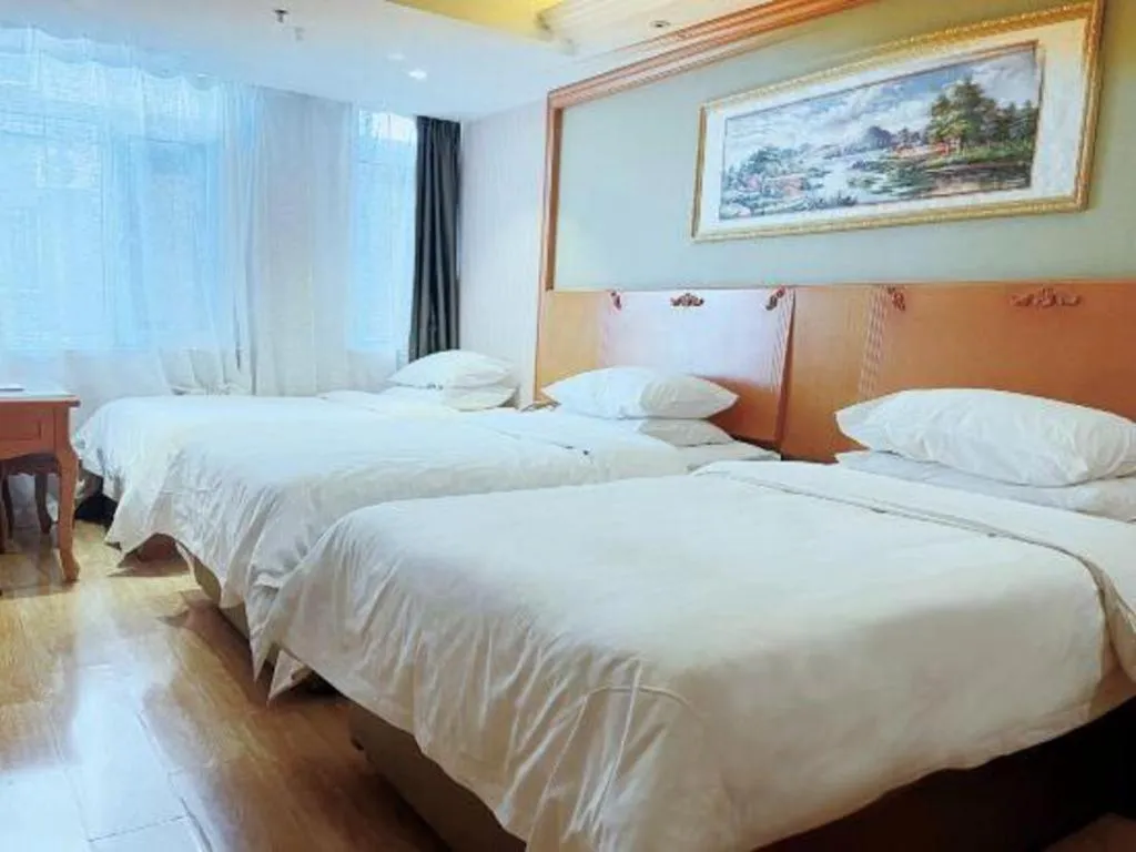 Bed in Vienna Hotel Inner Mongolia Tongliao Development Zone