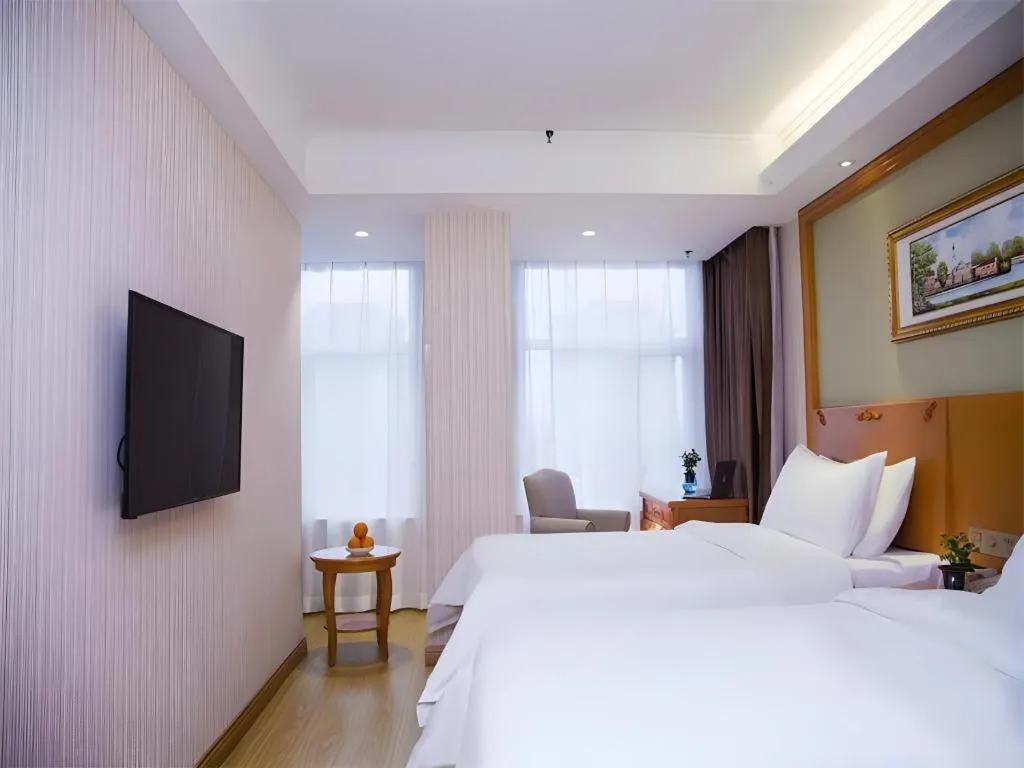 Bed in Vienna Hotel Inner Mongolia Tongliao Development Zone