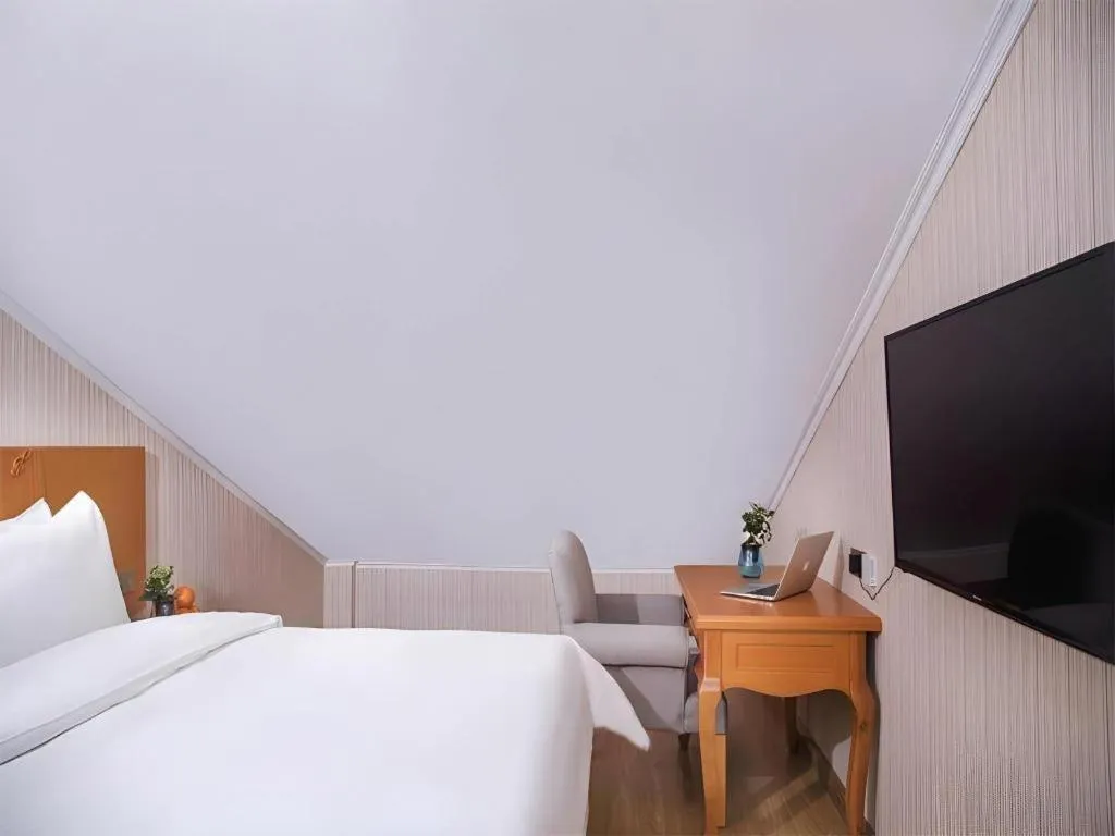 Bed in Vienna Hotel Inner Mongolia Tongliao Development Zone