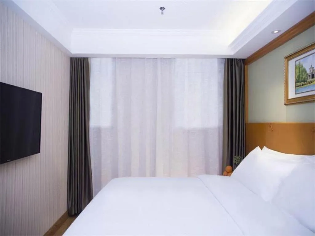 Bed in Vienna Hotel Inner Mongolia Tongliao Development Zone