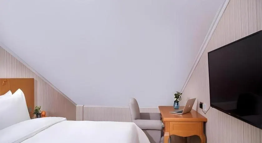 Bed in Vienna Hotel Inner Mongolia Tongliao Development Zone