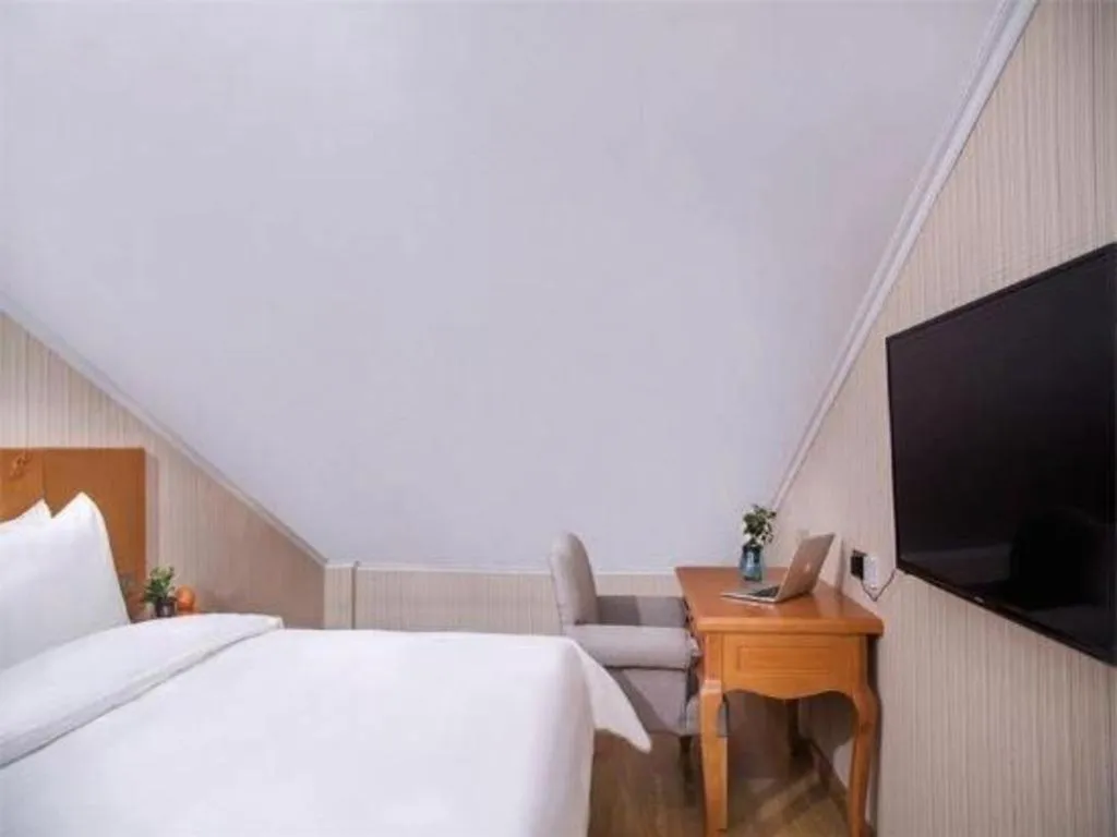 Bed in Vienna Hotel Inner Mongolia Tongliao Development Zone