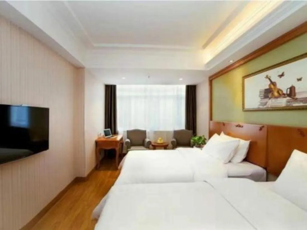 Bed in Vienna Hotel Inner Mongolia Tongliao Development Zone