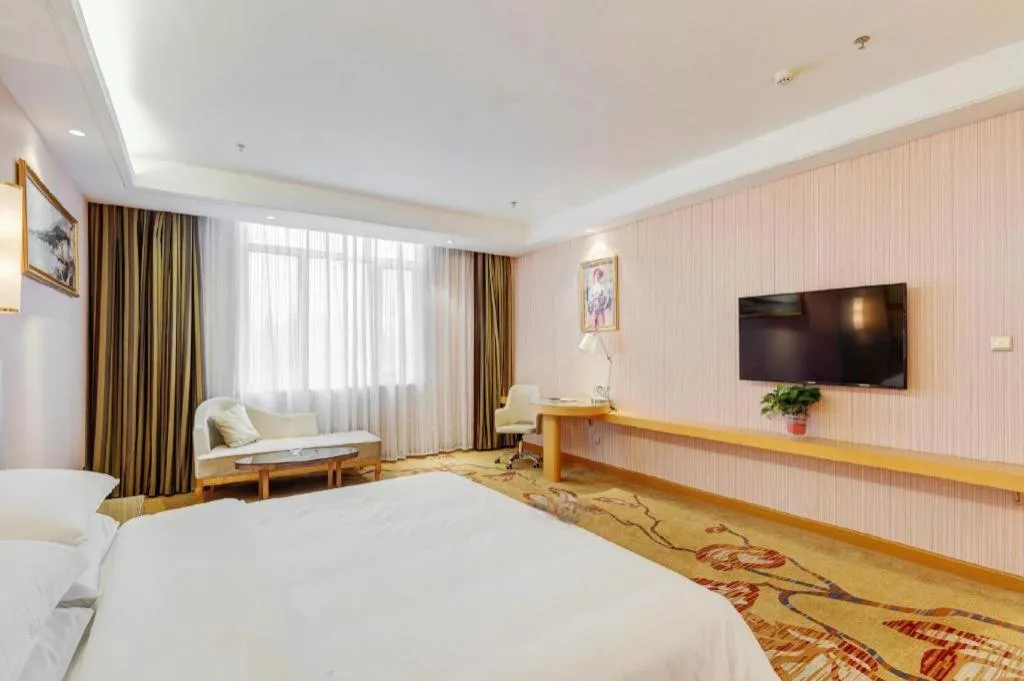 Bed in Vienna Hotel Shandong Qufu Sankong Landscape