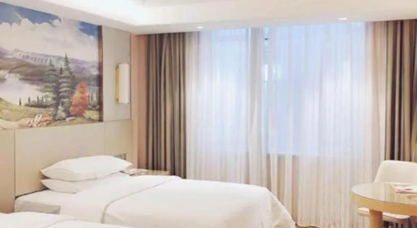 Bed in Vienna Hotel Shandong Qufu Sankong Landscape