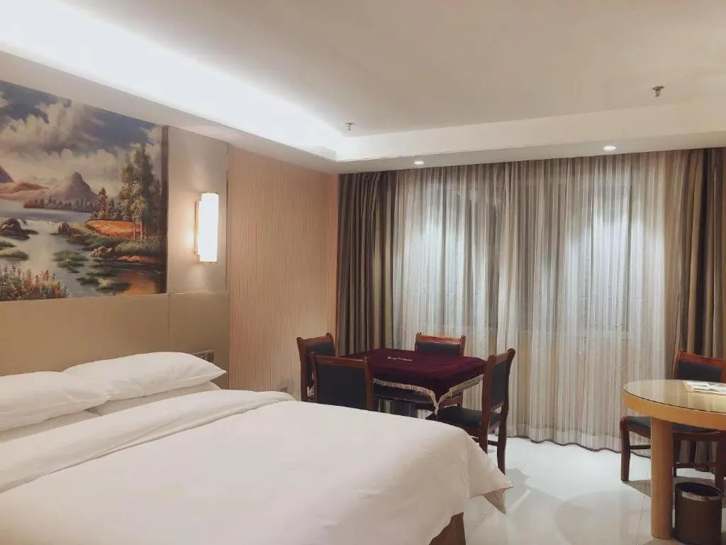 Bed in Vienna Hotel Shandong Qufu Sankong Landscape