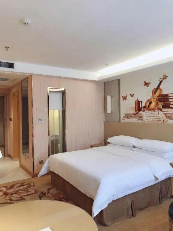 Bed in Vienna Hotel Shandong Qufu Sankong Landscape