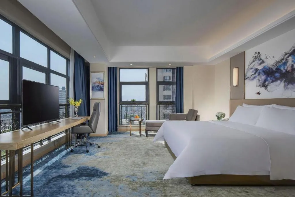 Bed in Vienna Hotel Shaanxi Hanzhong Central Square High-Speed Railway Station