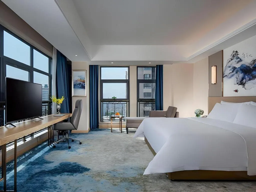 Bed in Vienna Hotel Shaanxi Hanzhong Central Square High-Speed Railway Station