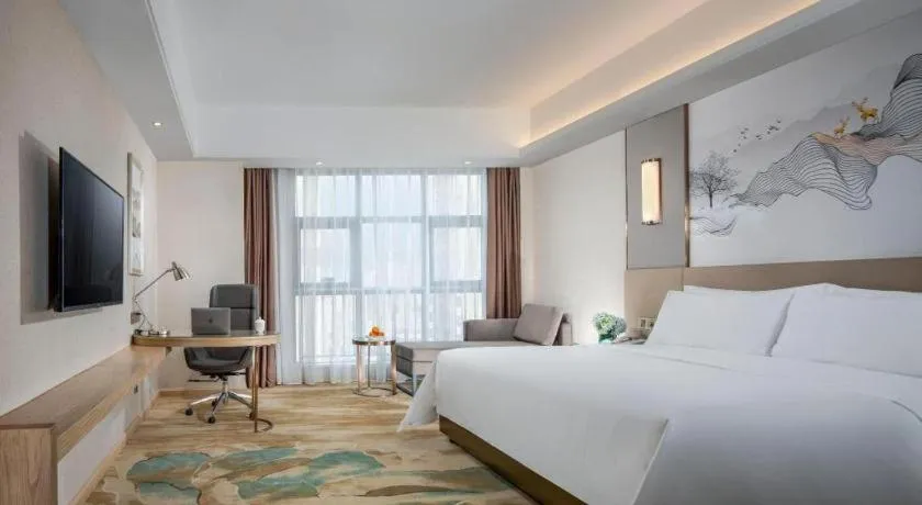 Bed in Vienna Hotel Shaanxi Hanzhong Central Square High-Speed Railway Station