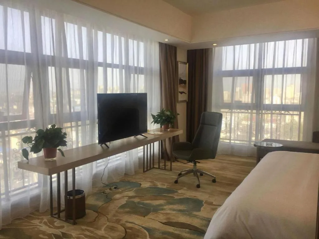 Bed in Vienna Hotel Shaanxi Hanzhong Central Square High-Speed Railway Station