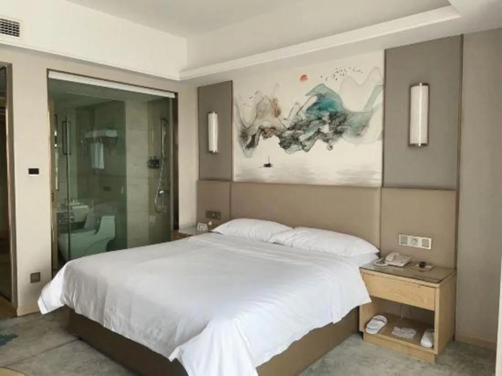 Bed in Vienna Hotel Shaanxi Hanzhong Central Square High-Speed Railway Station