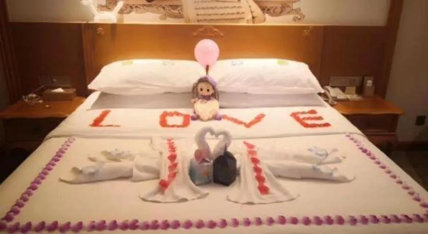 Bed in Vienna Hotel Shaanxi Hanzhong Central Square High-Speed Railway Station