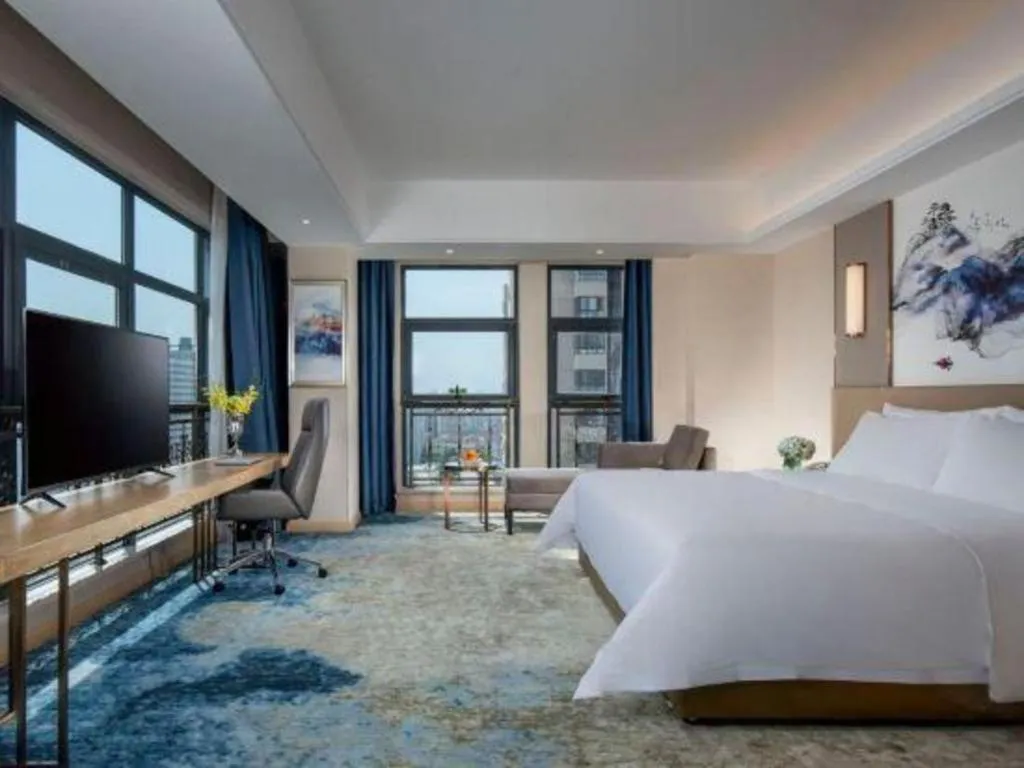 Bed in Vienna Hotel Shaanxi Hanzhong Central Square High-Speed Railway Station