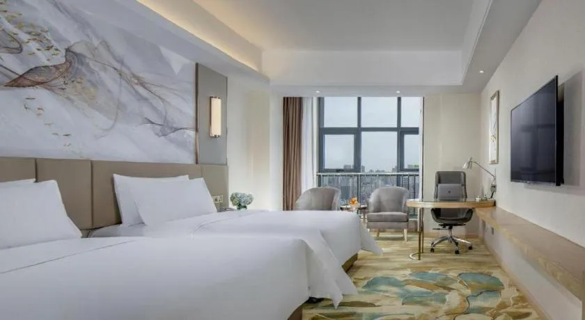 Bed in Vienna Hotel Shaanxi Hanzhong Central Square High-Speed Railway Station